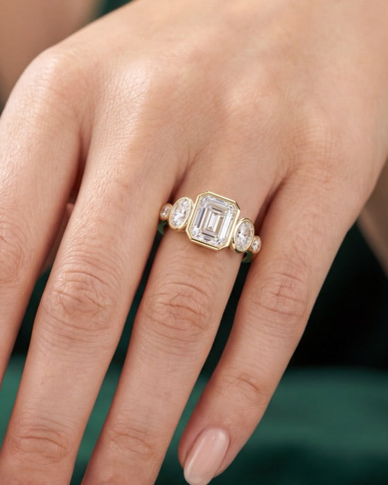 Valencia emerald engagement ring on the hand
