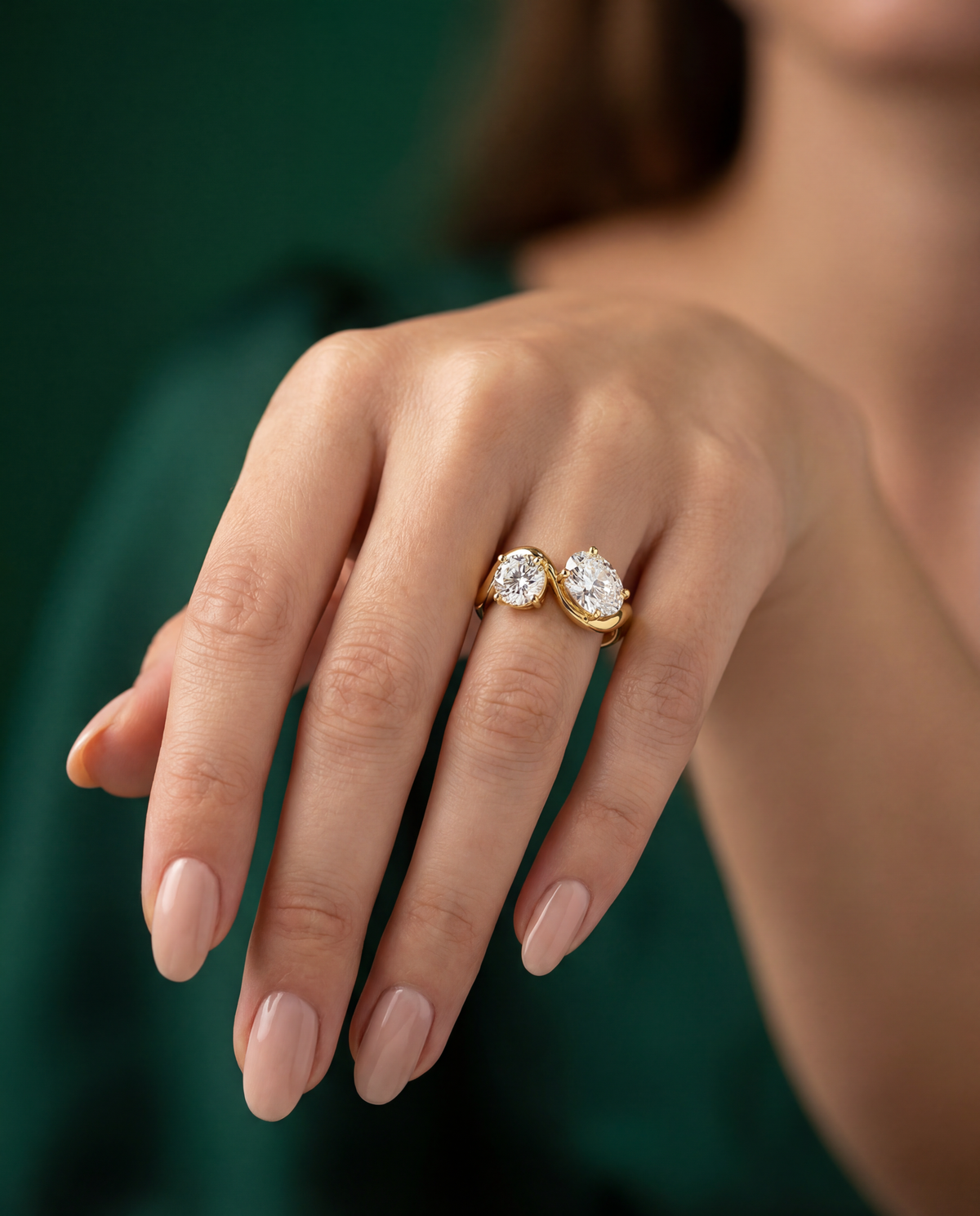 Amira oval toi-et-moi engagement ring worn on the hand