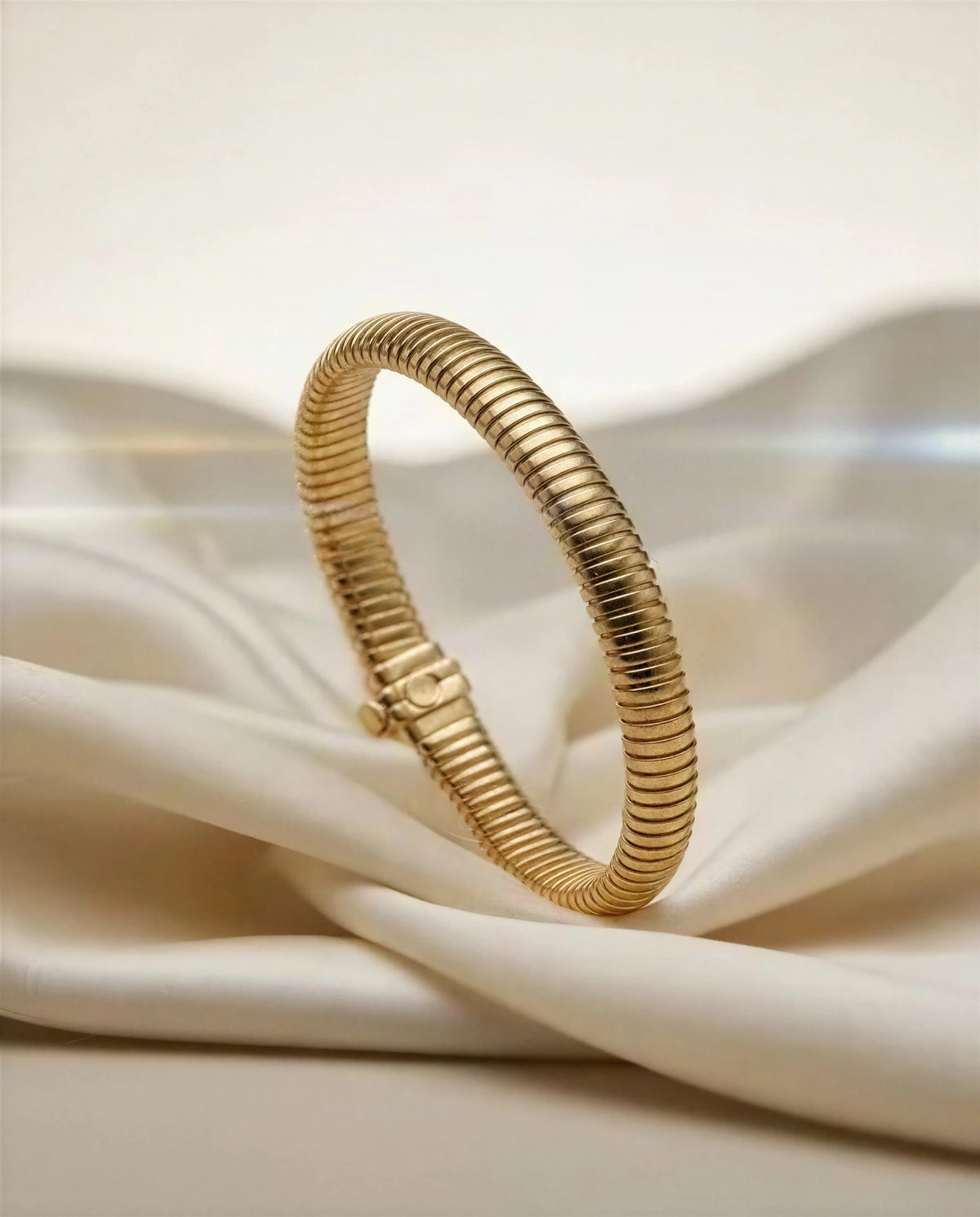Lunaria 14k gold tubogas bracelet on ivory satin