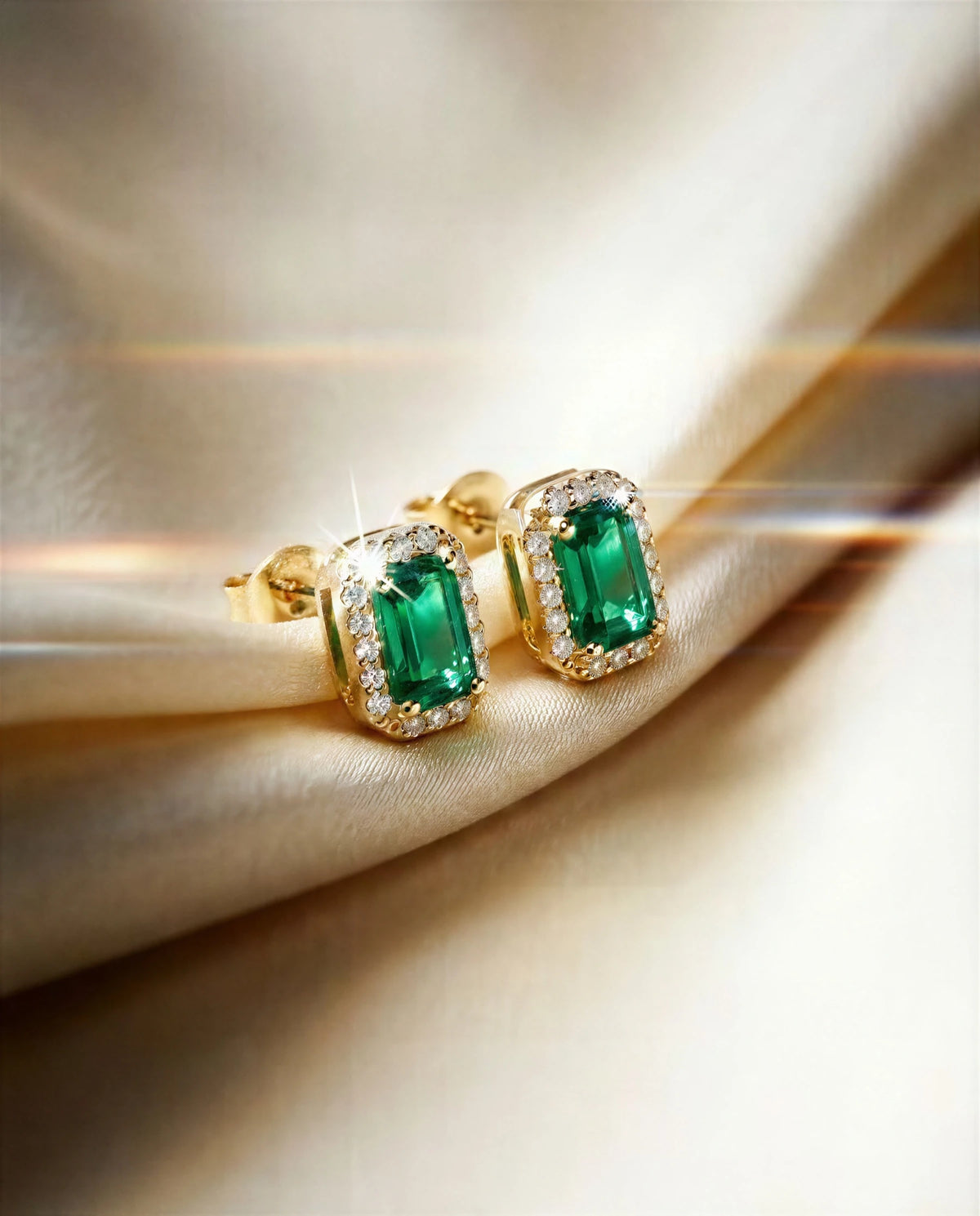 Cymbidium 14k gold emerald halo studs on ivory satin, another angle