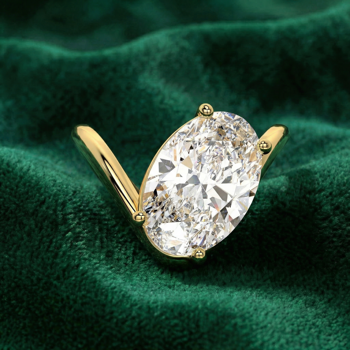 Celestia oval engagement ring in yellow gold on green velvet