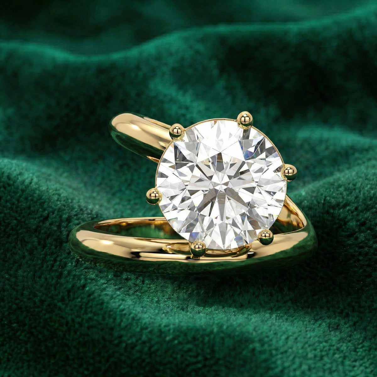Eclipse round engagement ring in yellow gold on green velvet