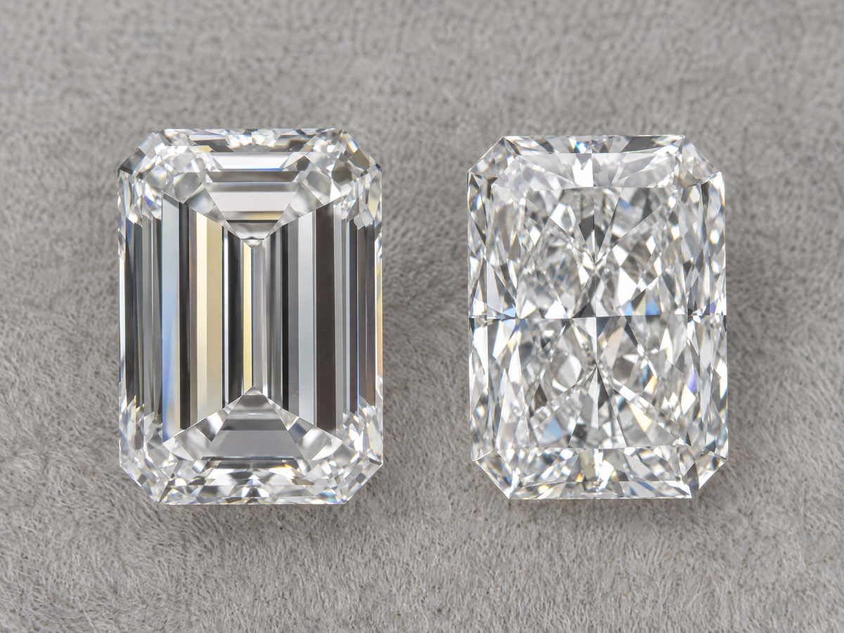 An emerald cut diamond and a radiant cut diamond of the same carat weight side by side, face up