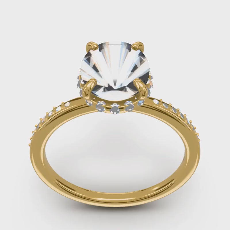 A diamond engagement ring turning in the Ring Studio