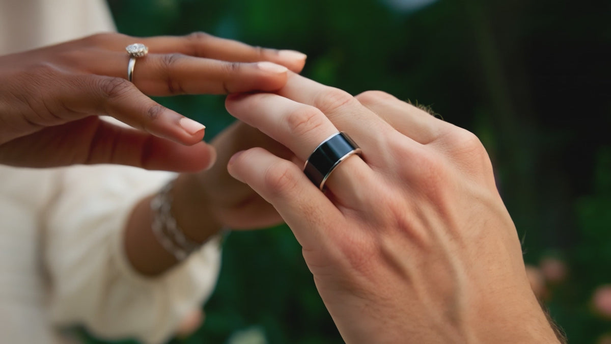 A couple holding hands in a garden