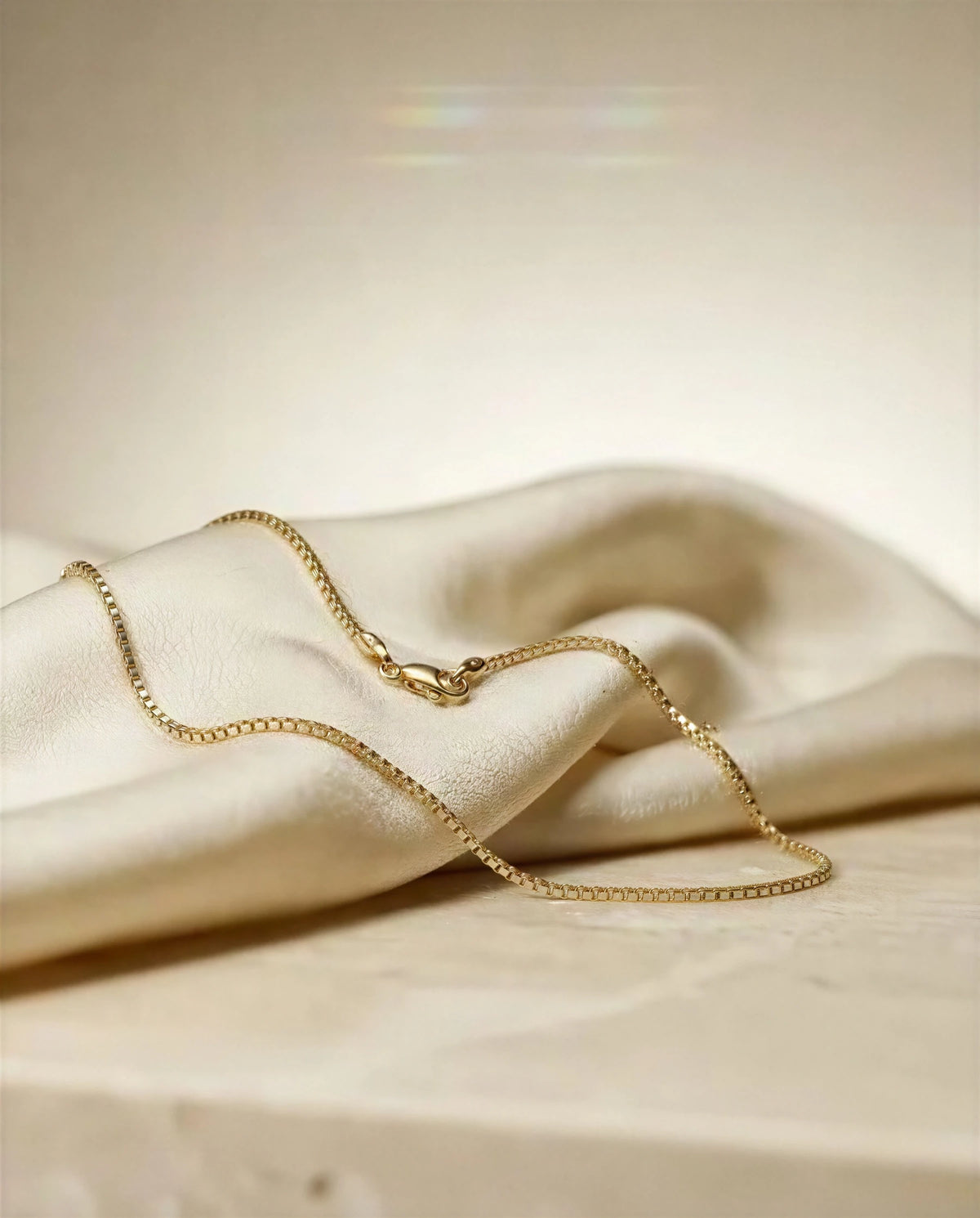 Wisteria 14k gold linked bracelet on ivory satin, another angle