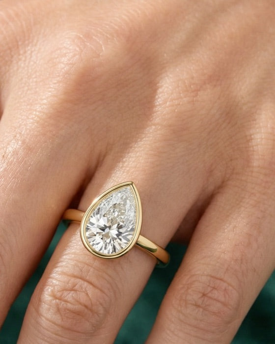 Odessa pear engagement ring on the hand